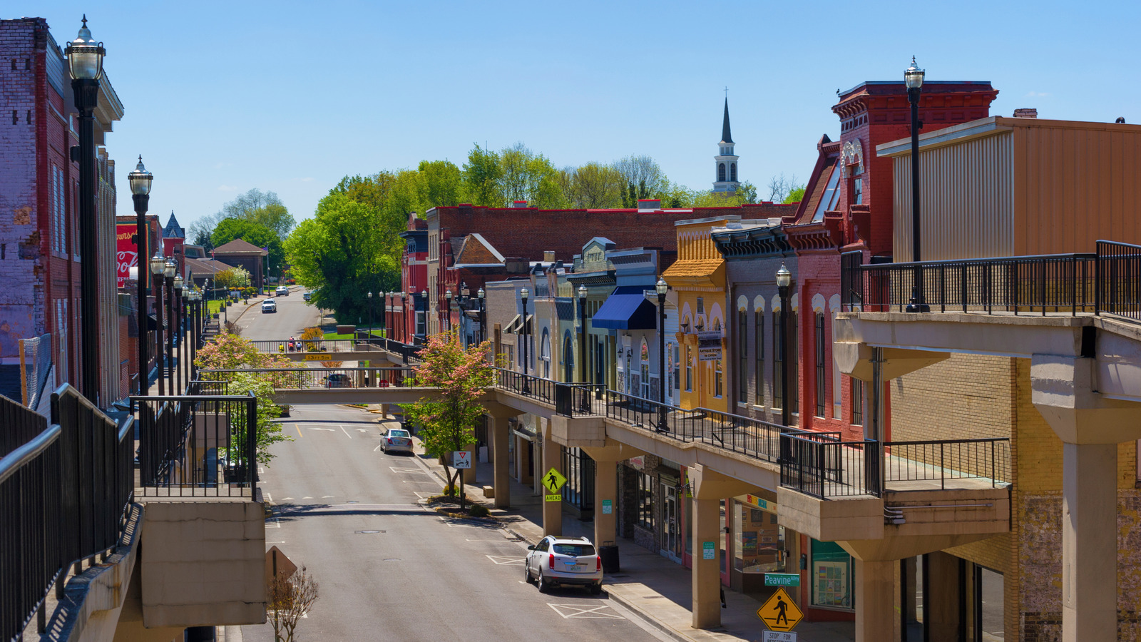 Historic downtown Morristown, Tennessee with colorful storefronts and pedestrian bridges